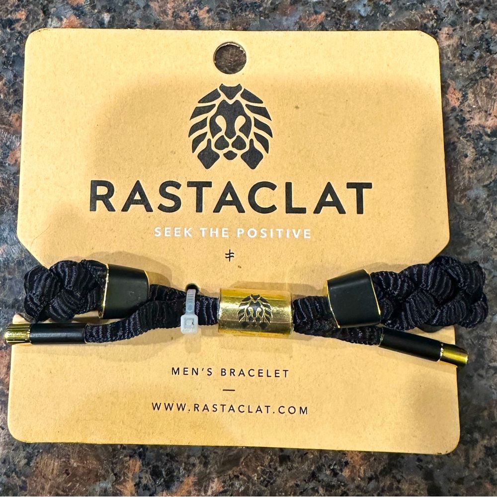 Unused black/gold Rastaclat bracelet